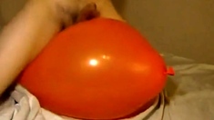 Big inflatable orange balloon humping cum