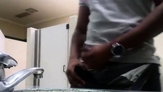 Black perv caught jerking in restroom